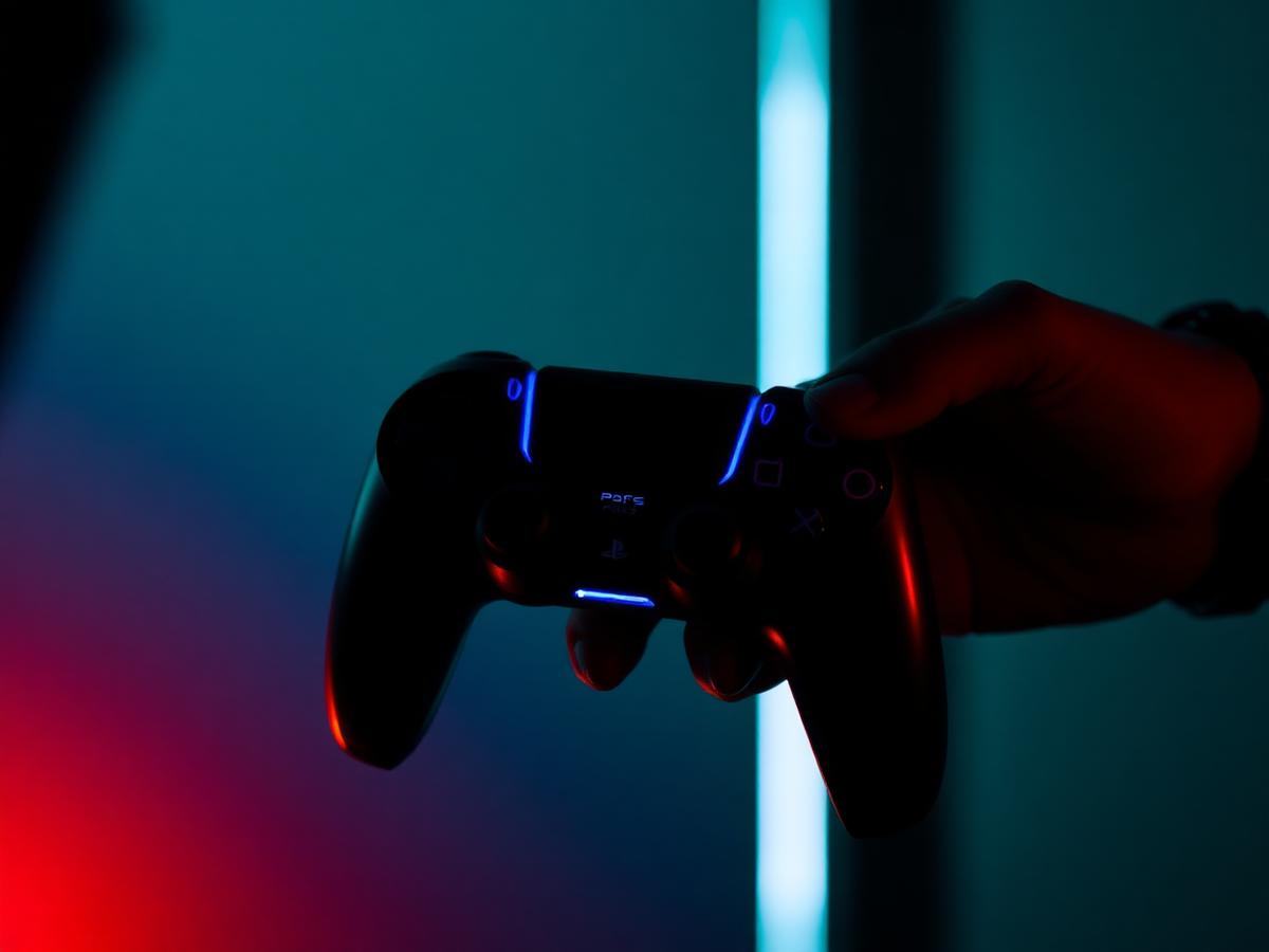 Console gamepads glowing in neon light