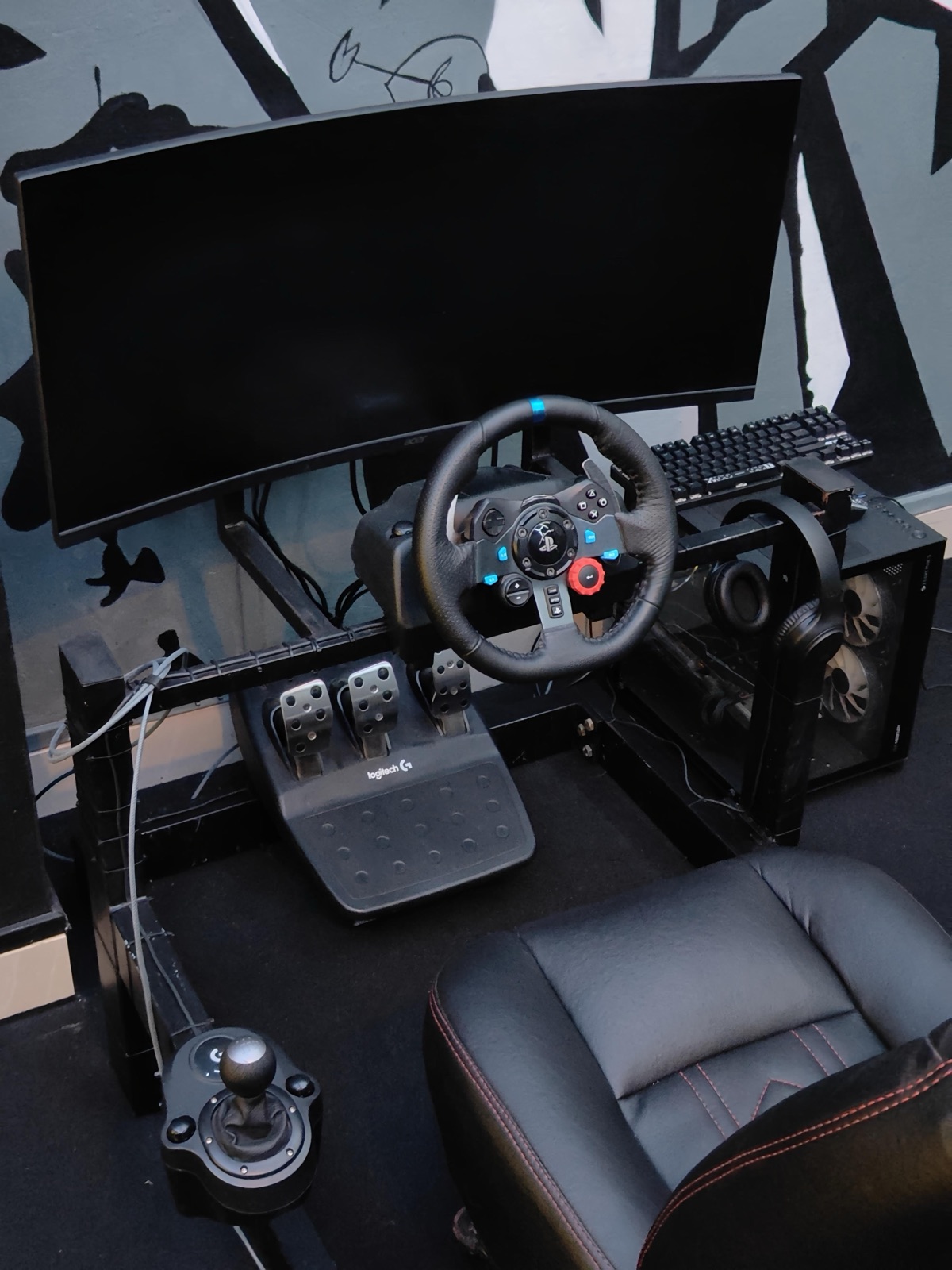 Club Exotism sim racing rig with steering wheel and seat